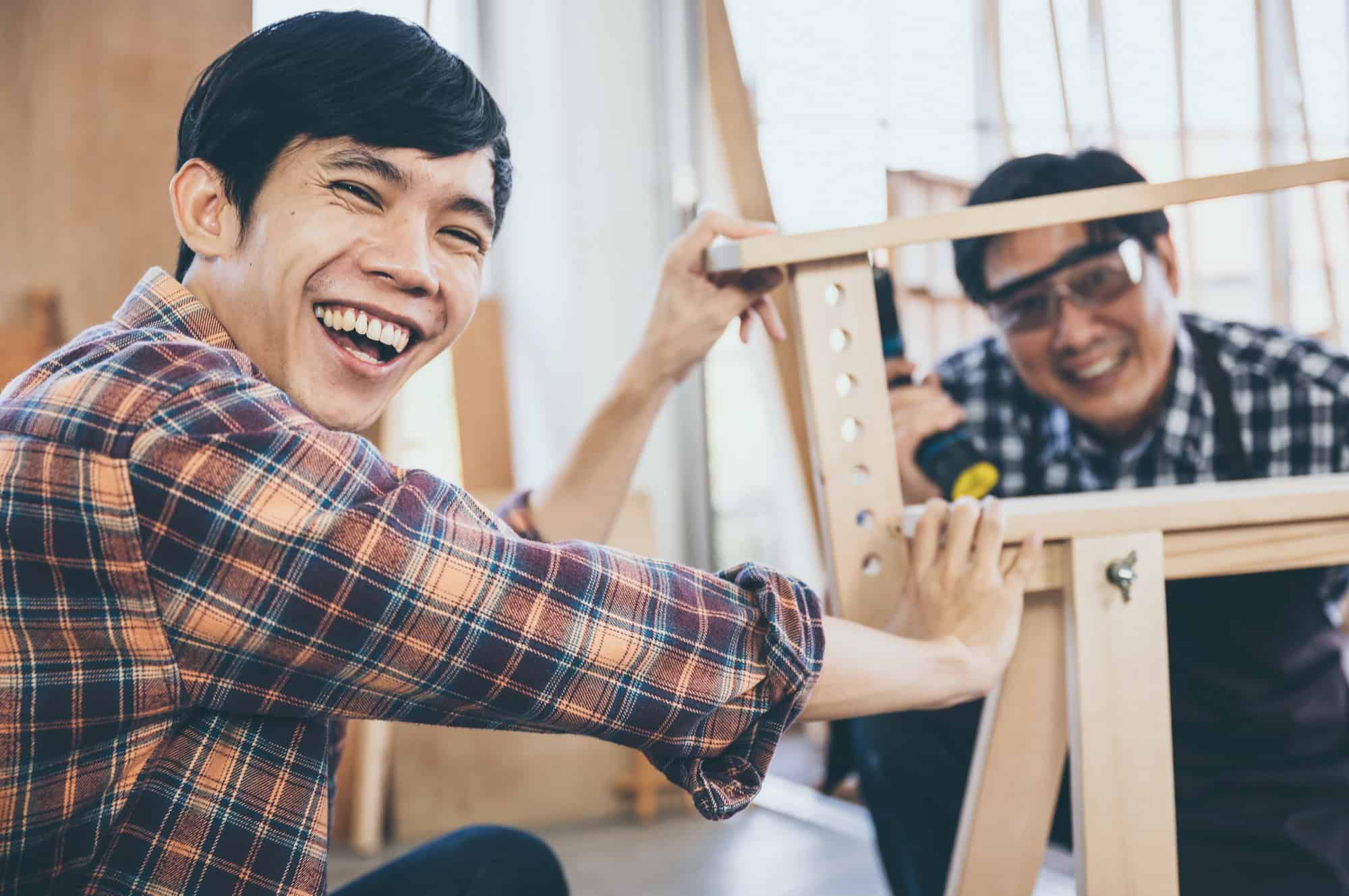 carpenters-team-work-together-creatively-creative-carpenter-working-with-wood-and-tools.jpg
